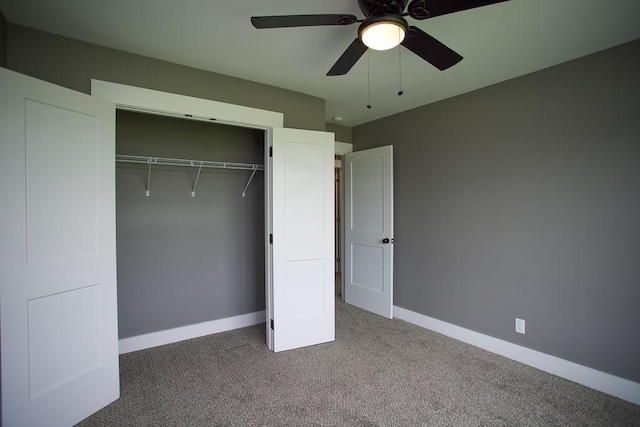 unfurnished bedroom with a closet, a ceiling fan, baseboards, and carpet floors