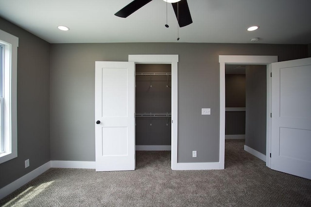 unfurnished bedroom featuring a walk in closet, baseboards, carpet, recessed lighting, and a closet