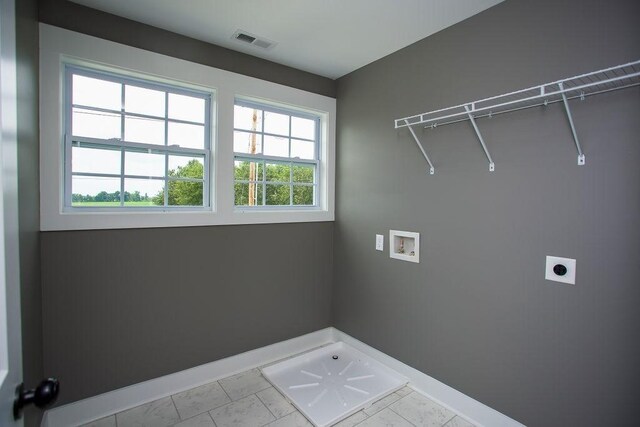 laundry area with visible vents, baseboards, washer hookup, laundry area, and hookup for an electric dryer