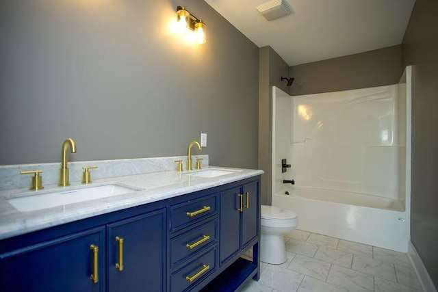 full bath featuring visible vents, marble finish floor, toilet, and a sink