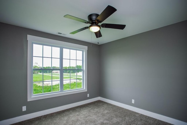 unfurnished room featuring visible vents, ceiling fan, baseboards, and carpet floors