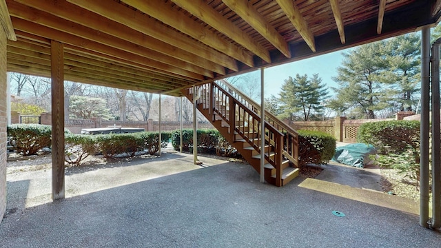 view of patio / terrace with stairs and fence