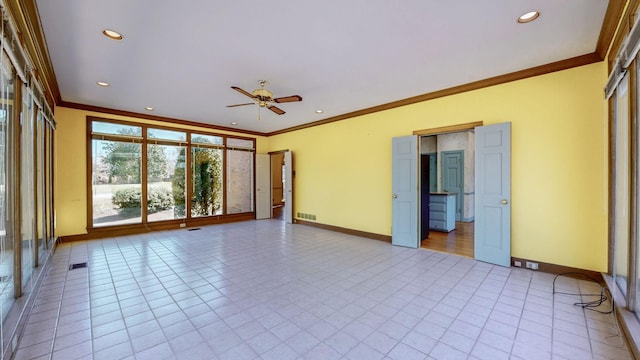 empty room with recessed lighting, visible vents, baseboards, and crown molding