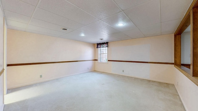 empty room with recessed lighting, carpet flooring, a paneled ceiling, and baseboards