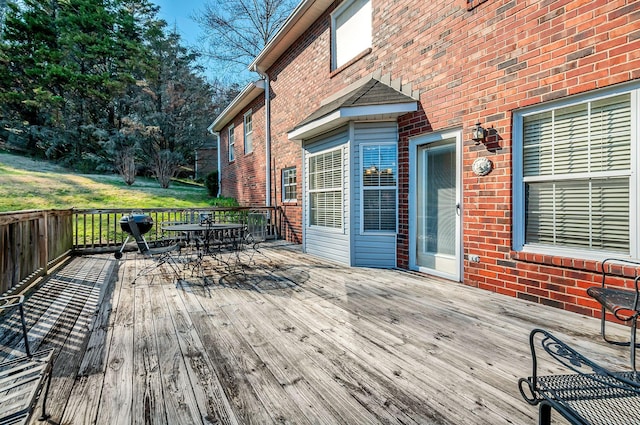 wooden deck with outdoor dining area