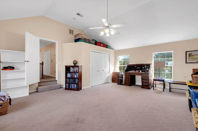 office with visible vents, carpet flooring, and lofted ceiling