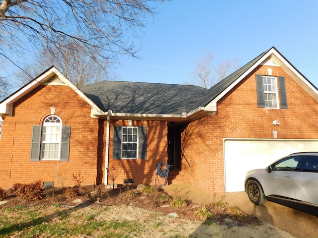 view of front facade with crawl space, brick siding, and roof with shingles