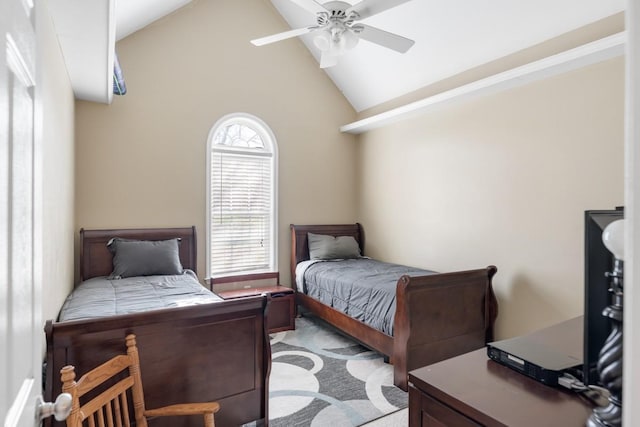 bedroom featuring carpet floors, high vaulted ceiling, and ceiling fan