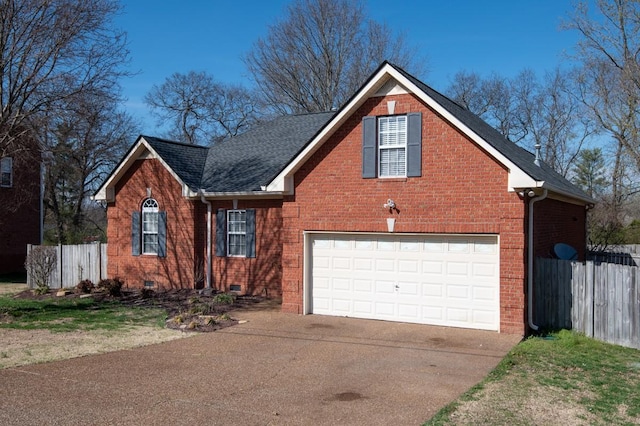 traditional-style home featuring crawl space, driveway, fence, and brick siding