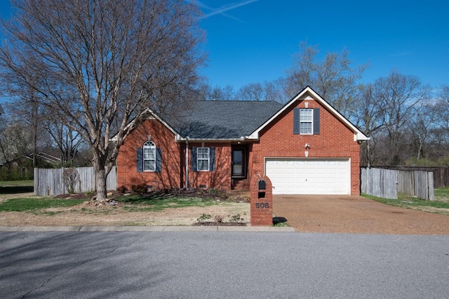 view of front of house with brick siding, concrete driveway, fence, and an attached garage
