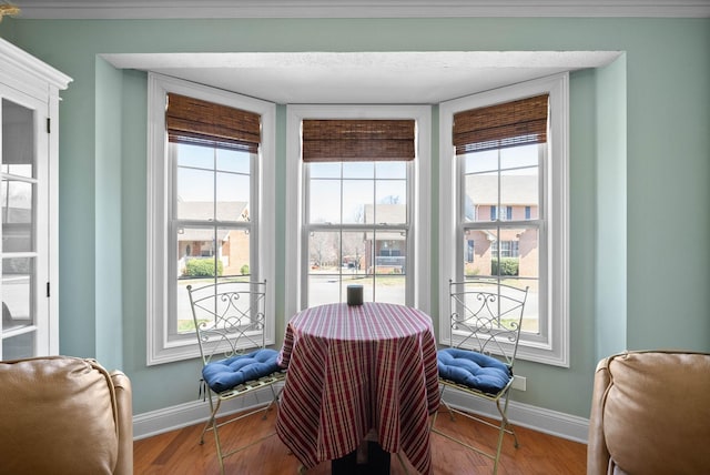 living area with wood finished floors and baseboards