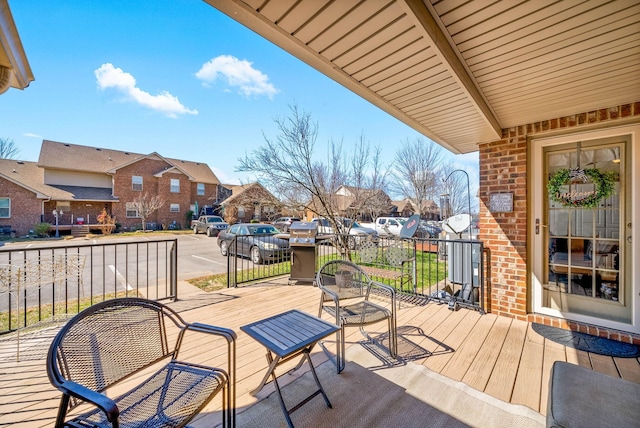 wooden deck featuring a residential view