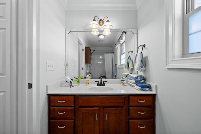 bathroom featuring a shower with shower curtain, ornamental molding, and vanity