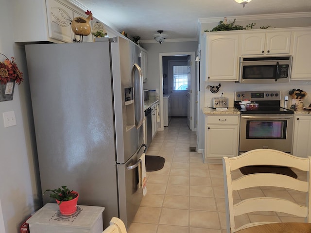 kitchen with light tile patterned flooring, white cabinetry, and stainless steel appliances