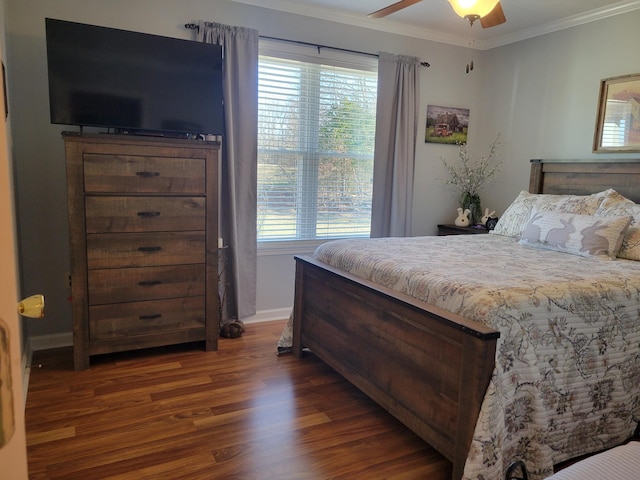 bedroom with baseboards, a ceiling fan, ornamental molding, and dark wood finished floors