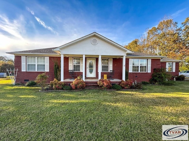 view of front of property with crawl space, brick siding, a porch, and a front lawn