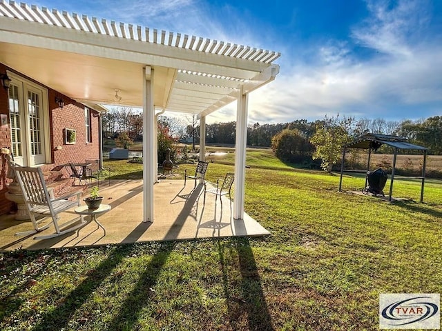 exterior space with a patio, a pergola, and a yard