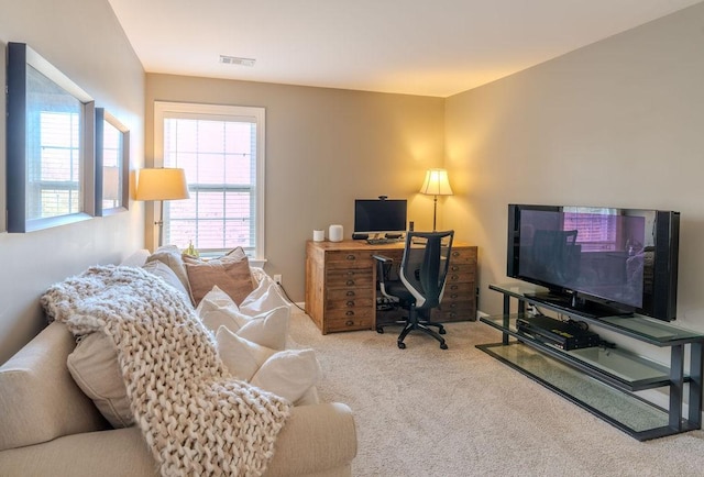 office space with visible vents and carpet floors