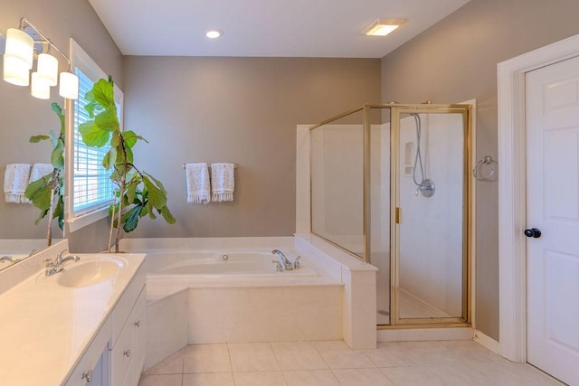 full bath with tile patterned floors, a stall shower, vanity, and a garden tub