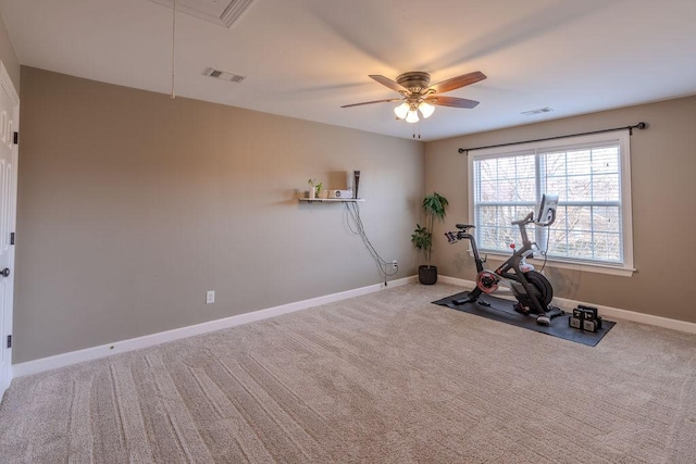 exercise area with visible vents, carpet flooring, and baseboards