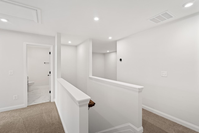 corridor with visible vents, an upstairs landing, recessed lighting, carpet floors, and baseboards