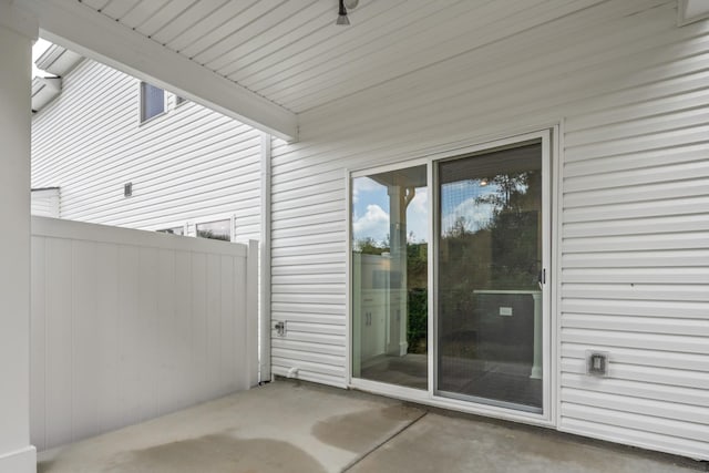 view of patio featuring fence