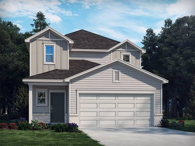 4205 Skyridge Dr, Nashville, TN 37207 - view of front of property featuring driveway, roof with shingles, an attached garage, board and batten siding, and brick siding