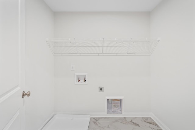 washroom featuring electric dryer hookup, marble finish floor, baseboards, hookup for a washing machine, and laundry area