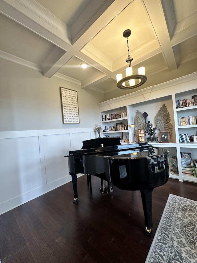 sitting room featuring beam ceiling, coffered ceiling, and dark wood finished floors