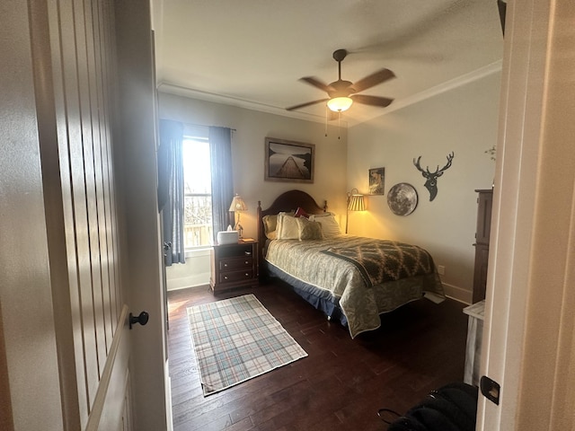 bedroom featuring dark wood finished floors, baseboards, and ornamental molding