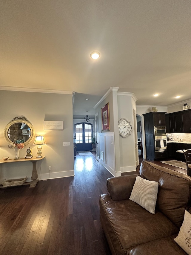 living room with dark wood finished floors, recessed lighting, baseboards, and ornamental molding