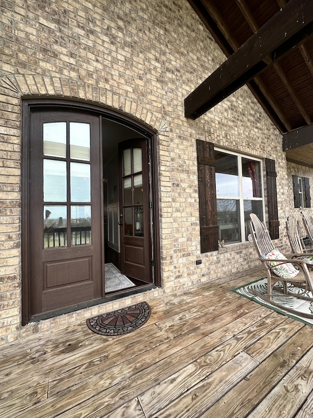 property entrance with brick siding