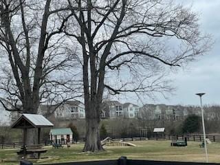 view of property's community with fence