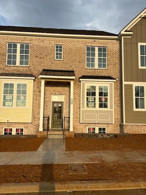 multi unit property featuring brick siding