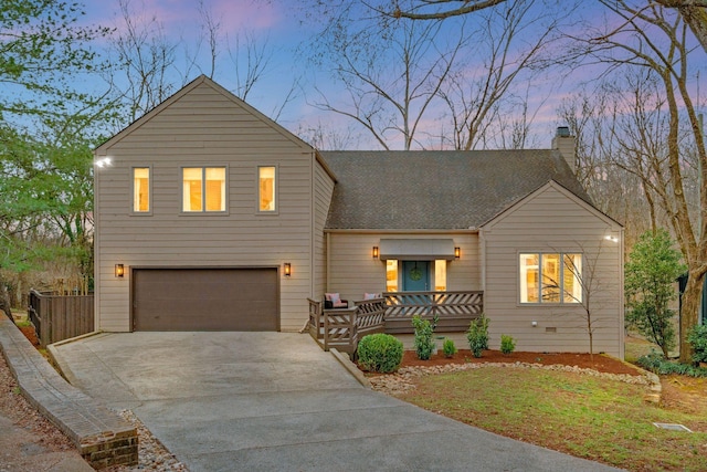 view of front of home with driveway, a chimney, a garage, and a shingled roof