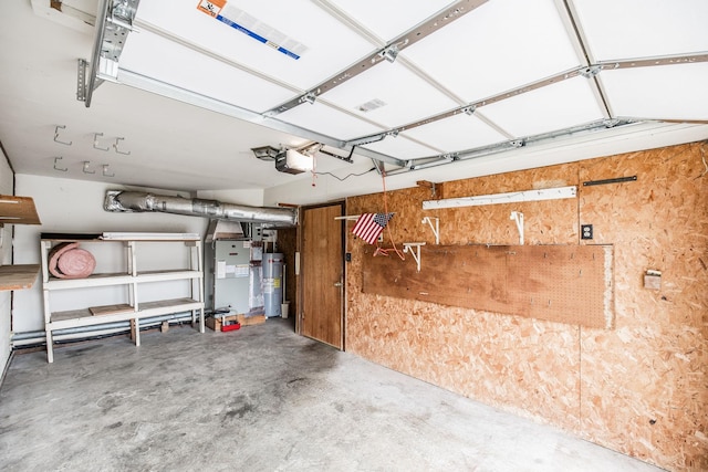 garage with electric water heater and a garage door opener