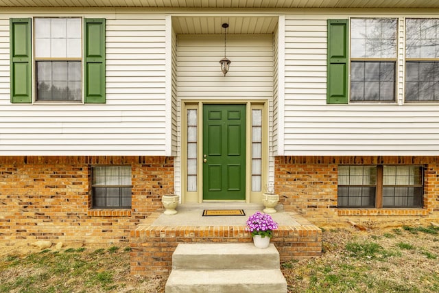 entrance to property with brick siding