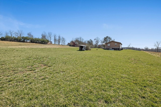 view of yard with a rural view