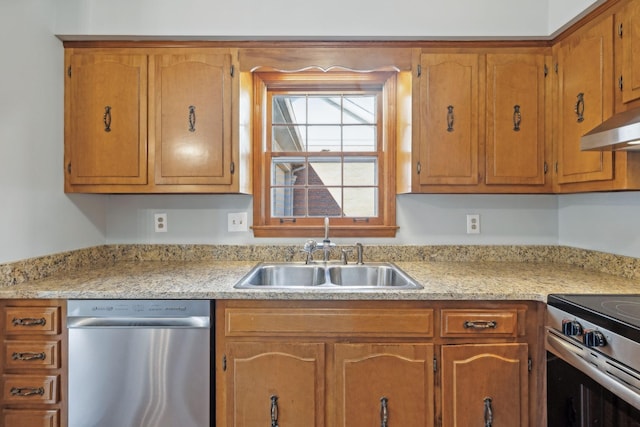 kitchen with a sink, stainless steel appliances, light countertops, under cabinet range hood, and brown cabinets