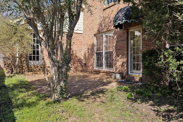 exterior space with brick siding