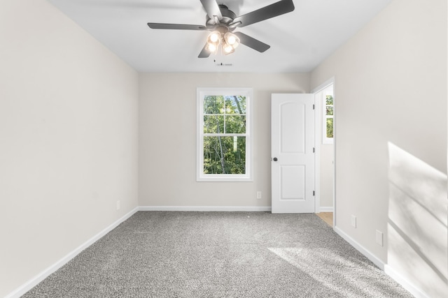 unfurnished room featuring baseboards, carpet, and ceiling fan