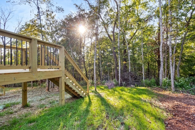 view of yard with stairs and a wooden deck