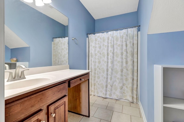 bathroom featuring tile patterned flooring and vanity