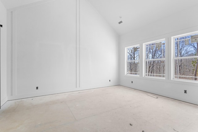 empty room with vaulted ceiling