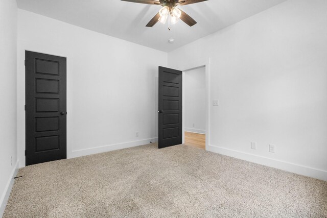 4410 Shiloh Canaan Rd, Palmyra, TN 37142 - carpeted spare room with a ceiling fan and baseboards