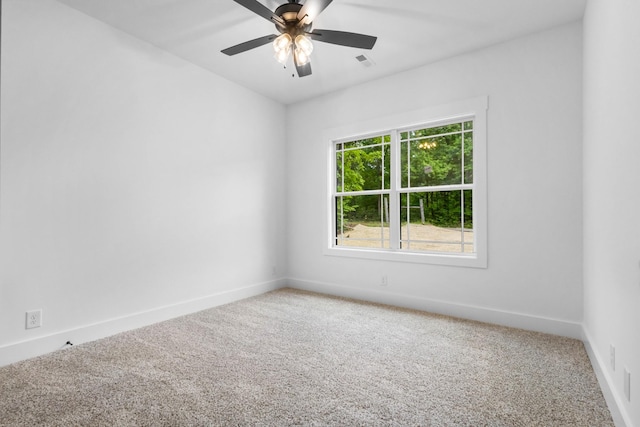 4410 Shiloh Canaan Rd, Palmyra, TN 37142 - spare room featuring light colored carpet, baseboards, and a ceiling fan
