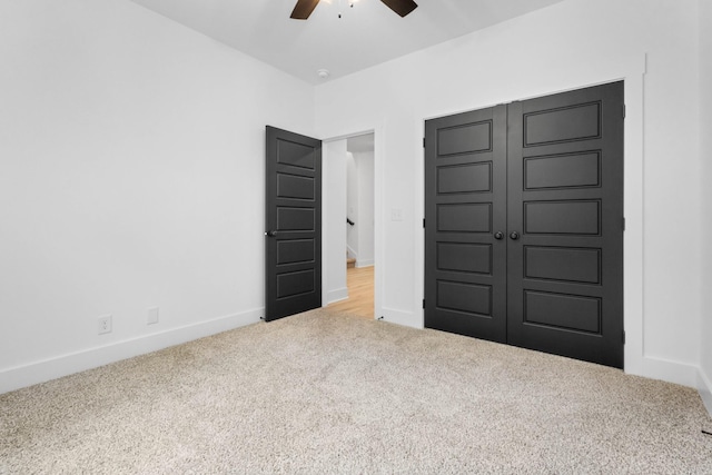 4410 Shiloh Canaan Rd, Palmyra, TN 37142 - unfurnished bedroom with carpet, baseboards, a closet, and ceiling fan