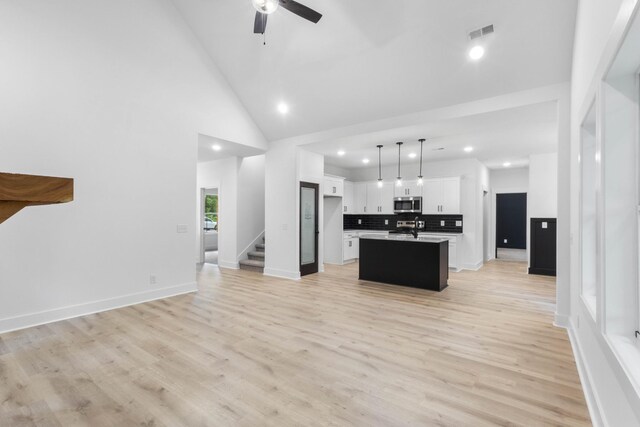 4410 Shiloh Canaan Rd, Palmyra, TN 37142 - kitchen featuring stainless steel microwave, open floor plan, a sink, recessed lighting, and a ceiling fan