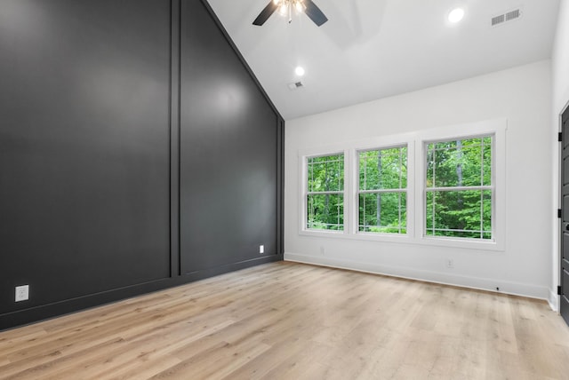 4410 Shiloh Canaan Rd, Palmyra, TN 37142 - empty room with ceiling fan, plenty of natural light, light wood-style floors, baseboards, and lofted ceiling