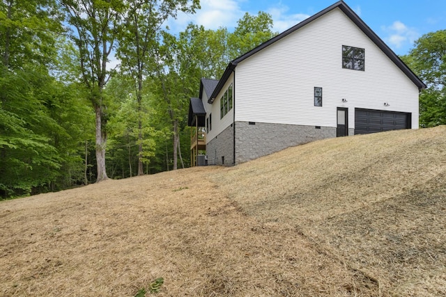 4410 Shiloh Canaan Rd, Palmyra, TN 37142 - view of property exterior featuring a garage, central AC unit, and crawl space